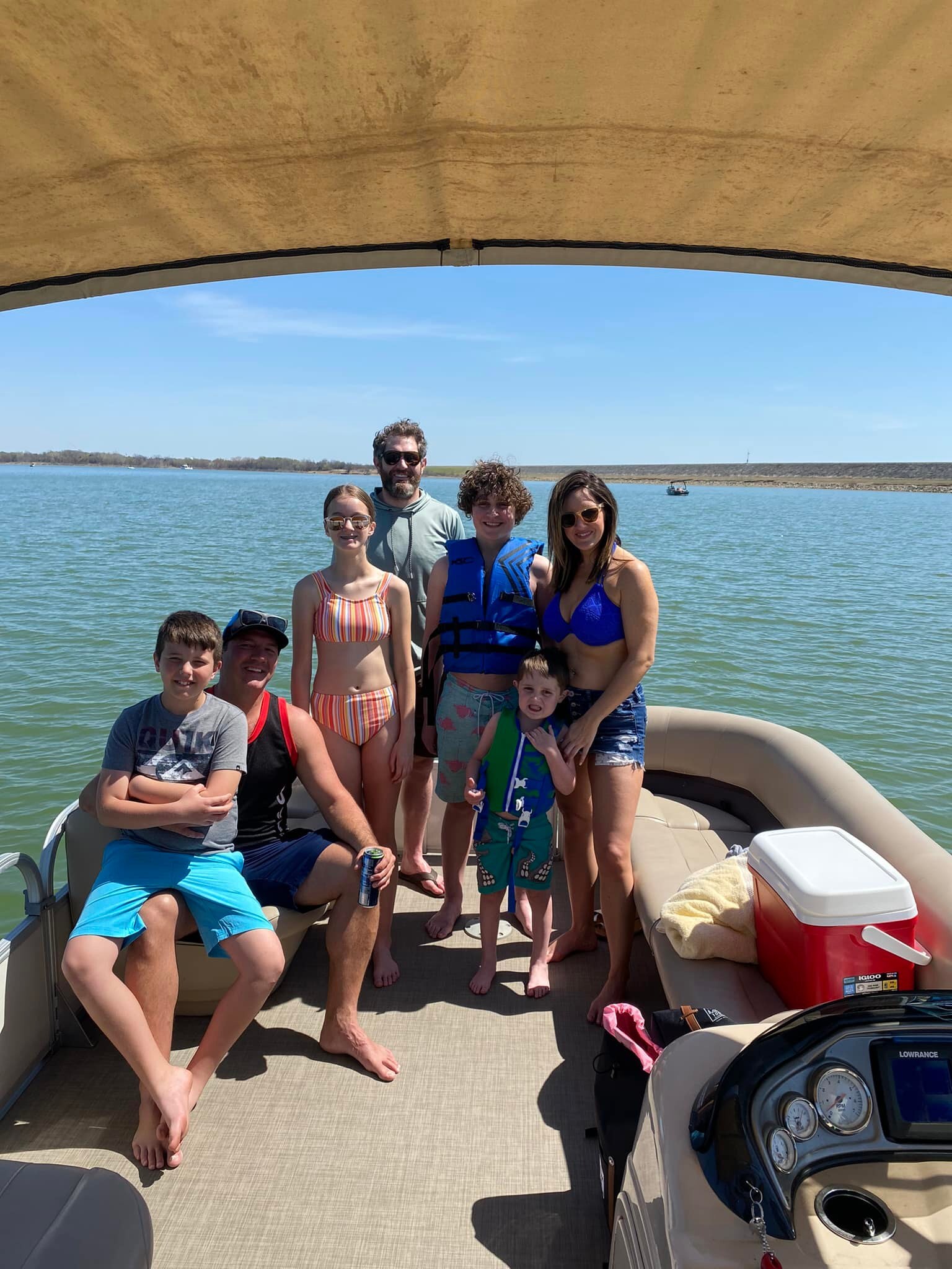 A family group together on a CM Boat Rentals pontoon